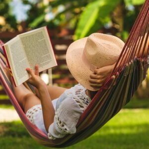 attractive sexy woman reading book in hammock picture id1145393520